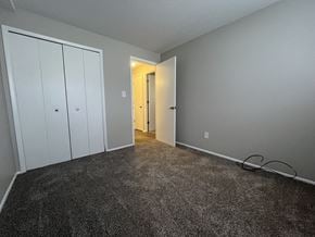 Chardon apartment for rent - bedroom with two closets and a carpeted floor