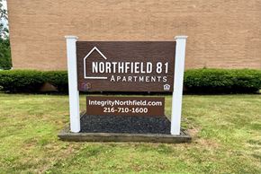 Northfield apartment for rent - a sign for northfield 81 apartments in front of a building