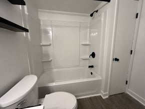 Northfield apartment for rent - a white bathroom with a toilet and a tub
