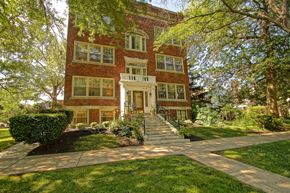 Cleveland apartment for rent - a large brick house with trees in front of it