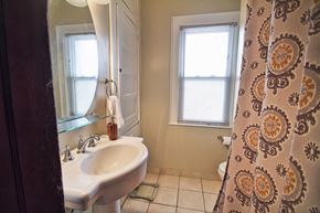 Lakewood apartment for rent - a bathroom with a sink and a shower curtain