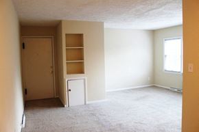 Cleveland Heights apartment for rent - an empty living room with shelves and a door