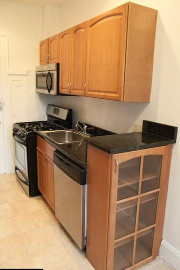 Cleveland Heights apartment for rent - a kitchen with a stove and a sink