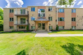 Northfield apartment for rent - A large apartment building with a grassy front yard.
