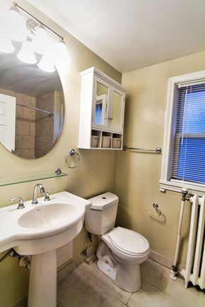 Lakewood apartment for rent - a bathroom with a sink toilet and a mirror