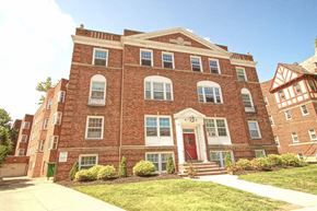 Lakewood apartment for rent - the front of a brick building with a red door