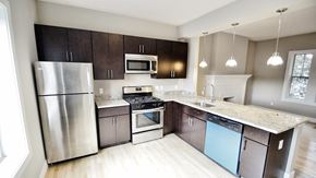 Cleveland apartment for rent - a kitchen with stainless steel appliances and marble counter tops