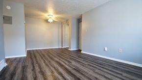Berea apartment for rent - an empty living room with wood flooring and a ceiling fan