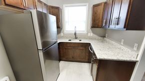Lakewood apartment for rent - a kitchen with stainless steel appliances and marble counter tops