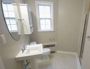 Lakewood apartment for rent - a bathroom with a sink toilet and a mirror