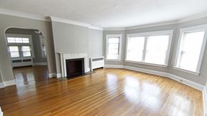 Cleveland Heights apartment for rent - an empty living room with wood floors and a fireplace