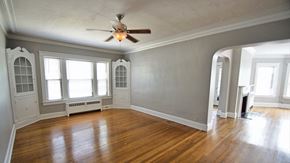 Cleveland Heights apartment for rent - an empty living room with wood floors and a ceiling fan