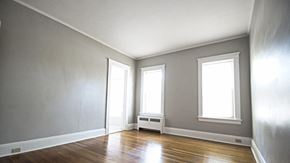 Cleveland Heights apartment for rent - an empty room with a wood floor and three windows