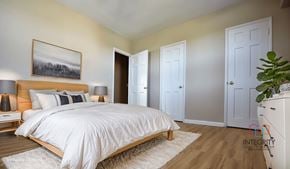 Cleveland apartment for rent - A bedroom with a large bed and a painting on the wall Integrity Realty, Cleveland, OH, 44120