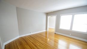 Cleveland Heights apartment for rent - an empty room with a hard wood floor and large windows