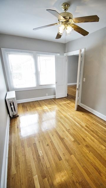 Cleveland Heights apartment for rent - an empty living room with wood floors and a ceiling fan