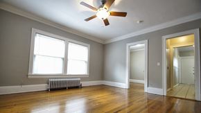 Cleveland Heights apartment for rent - the living room of an empty house with a ceiling fan