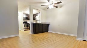 Berea apartment for rent - A room with a ceiling fan and wooden flooring.