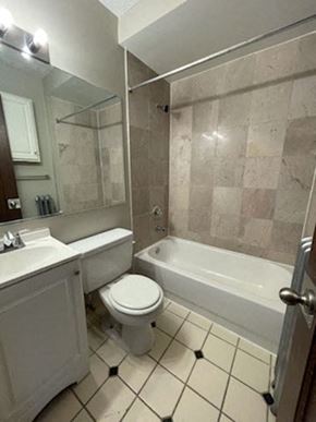 Cleveland apartment for rent - a bathroom with a toilet and a sink and a bath tub