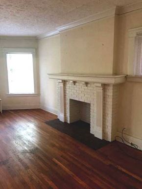 Cleveland Heights apartment for rent - a living room with a fireplace and a wooden floor