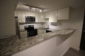 Cleveland apartment for rent - A kitchen with granite countertops and stainless steel appliances.