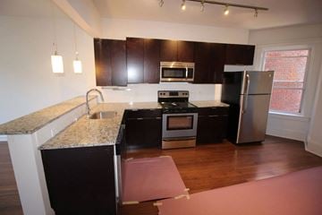 Cleveland apartment for rent - A kitchen with a granite counter top and stainless steel appliances.
