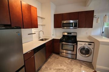 Lakewood apartment for rent - A kitchen with brown cabinets and stainless steel appliances.