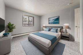 Berea apartment for rent - A bedroom with a large bed and a television. at Integrity Berea Apartments, Berea, 44017