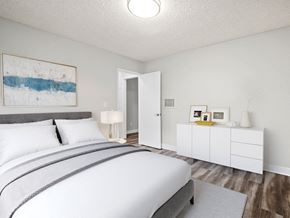 North Hollywood apartment for rent - Hardwood floored bedroom with private closets and ceiling-mounted light fixtures..