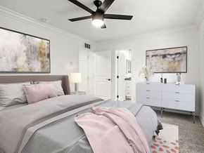 Los Angeles apartment for rent - Carpeted bedroom with ceiling fan and access to private bathroom.