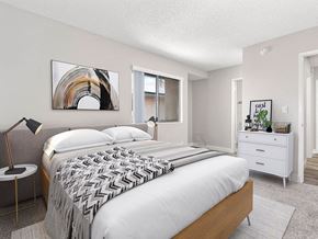 Sylmar apartment for rent - Carpeted bedroom with private bathroom and large exterior windows.