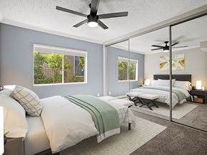 Sherman Oaks apartment for rent - Carpeted bedroom with ceiling fan and large mirrored closets.