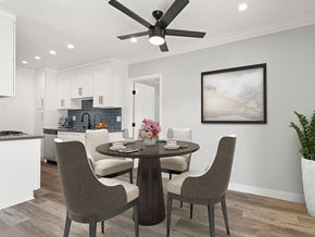Valley Glen apartment for rent - Dining room with hardwood floors, ceiling fan, and view of modern kicthen.