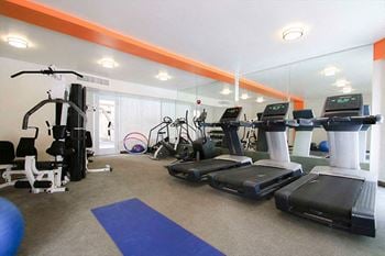 Fitness center with treadmills and weight equipment