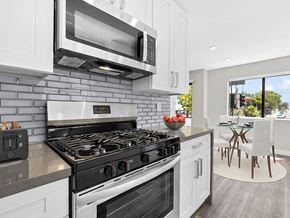 Valley Glen apartment for rent - Blue tiled kitchen with stainless steel oven, microwave, and fridge.