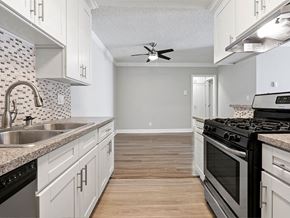 Los Angeles apartment for rent - Custom tiled kitchen with stainless steel sink, oven, and fixtures.