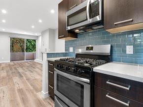 Los Angeles apartment for rent - Blue tiled kitchen with stainless steel oven and microwave.