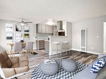 North Hollywood apartment for rent - an open living room and kitchen with a couch and chairs