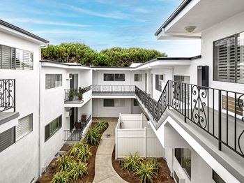 Modern styled courtyard with walk up access to apartment homes.