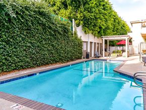 Valley Glen apartment for rent - Community pool and lounging area at Woodridge Apartments.