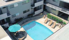 Los Angeles apartment for rent - Aerial image of gated pool with lounging area.