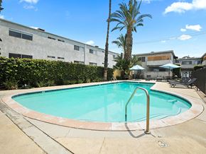 Sherman Oaks apartment for rent - One of two large gated pools and lounging area.
