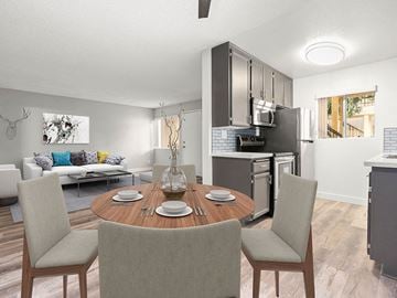 Reseda apartment for rent - A modern kitchen with a dining table set for four.