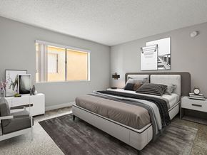 Reseda apartment for rent - Carpeted bedroom with accent wall and large natural light window.