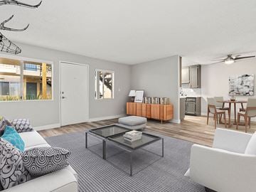 Reseda apartment for rent - A living room with a grey carpet and a glass coffee table.