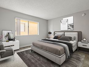 Reseda apartment for rent - Carpeted bedroom with accent wall and large natural light window.