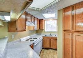 San Antonio apartment for rent - a kitchen with wooden cabinets and a white counter top