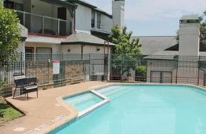 San Antonio apartment for rent - a swimming pool in front of an apartment building