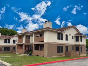 San Antonio apartment for rent - A large building with a red line in front of it.