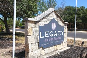 San Antonio townhouse for rent - a sign for legacy at crown heights in front of a street